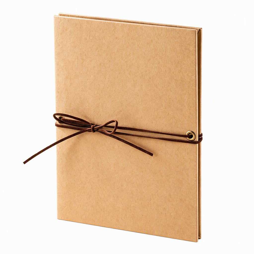Accordion scrapbook album with kraft-colored cover and brown tie closure.