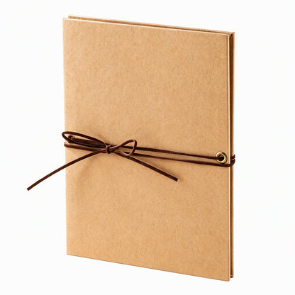 Accordion scrapbook album with kraft-colored cover and brown tie closure.