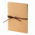 Accordion scrapbook album with kraft-colored cover and brown tie closure.