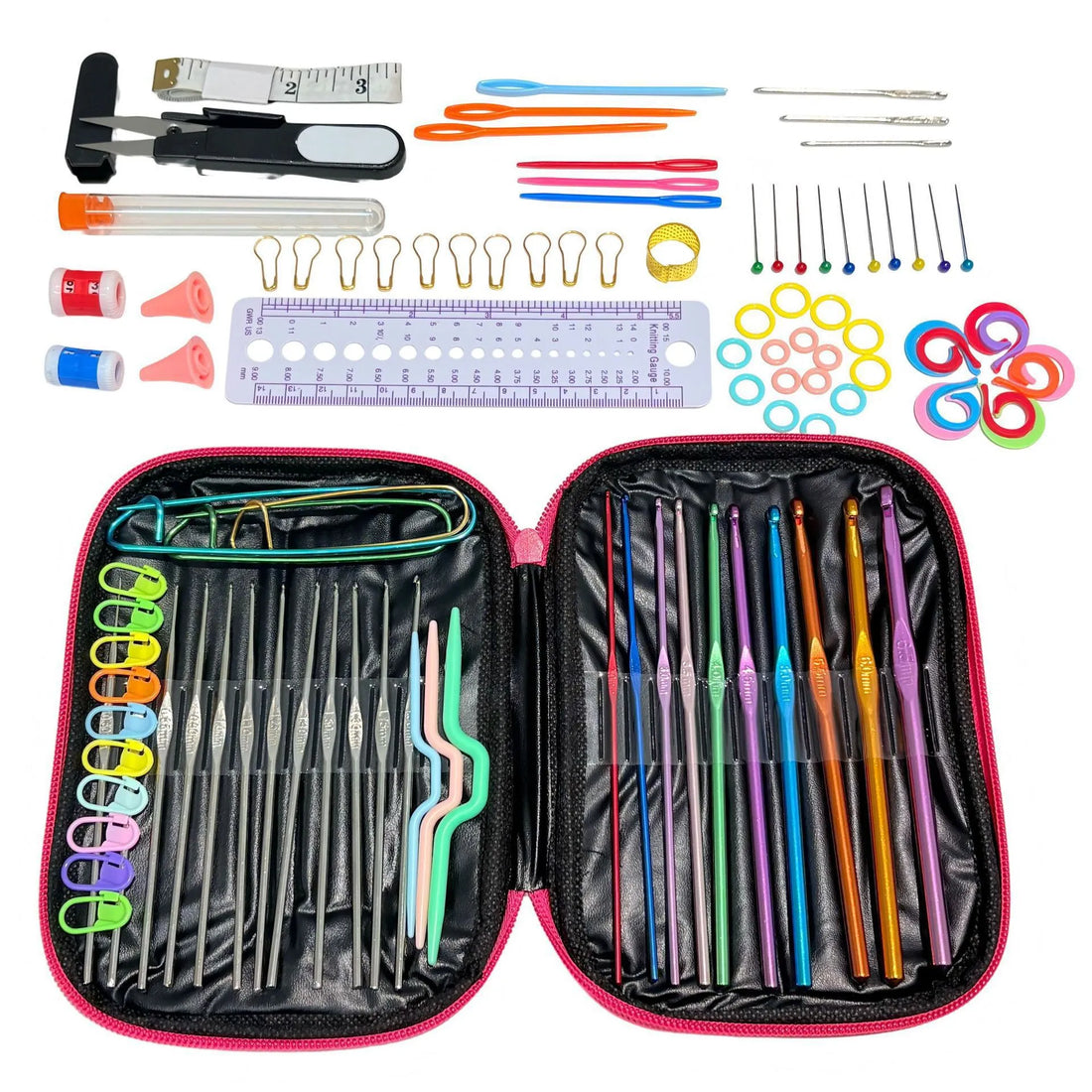 Pink crochet case open, with hooks organized inside and needles, markers, measuring tape and small tools laid out above.