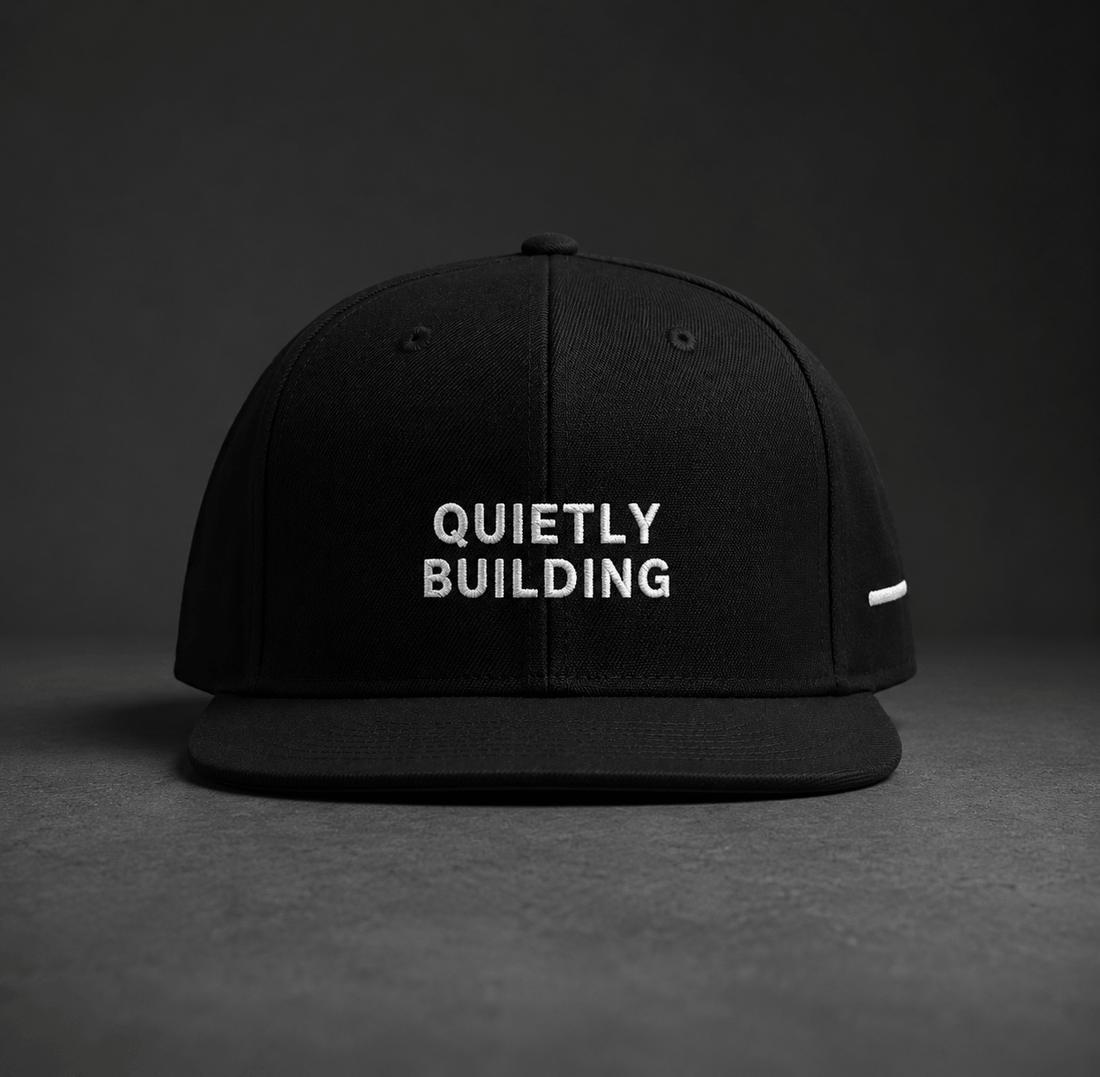TheCapTribe Quietly Building black premium snapback with white 3D puff embroidery front view