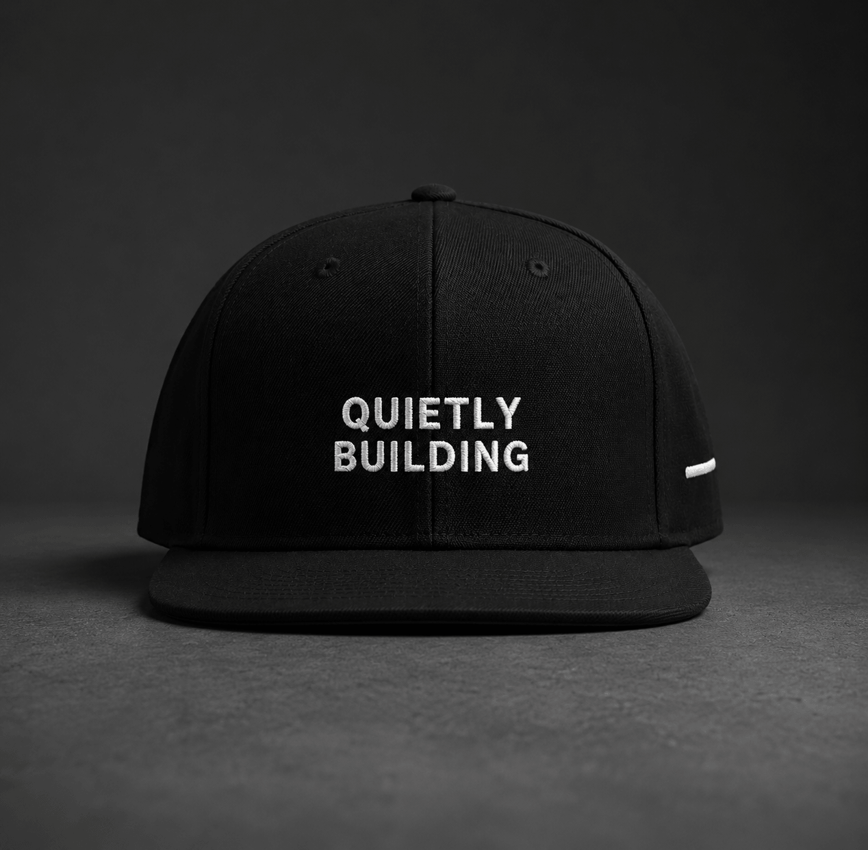 TheCapTribe Quietly Building black premium snapback with white 3D puff embroidery front view