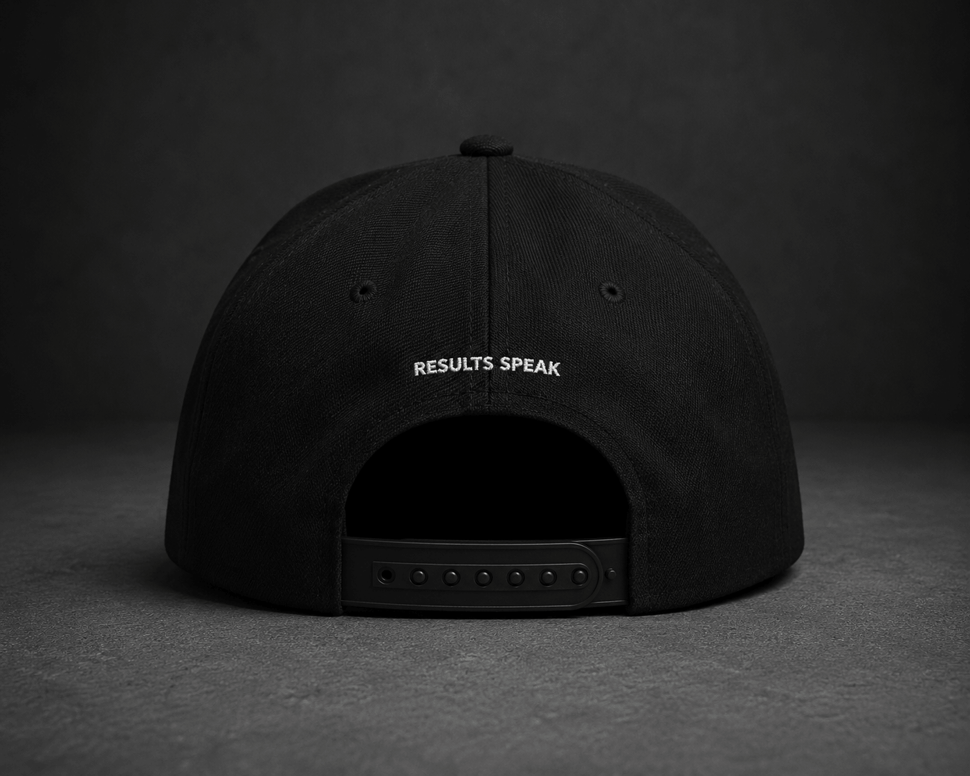 Side view of TheCapTribe Quietly Building black premium snapback with minimalist signature embroidery