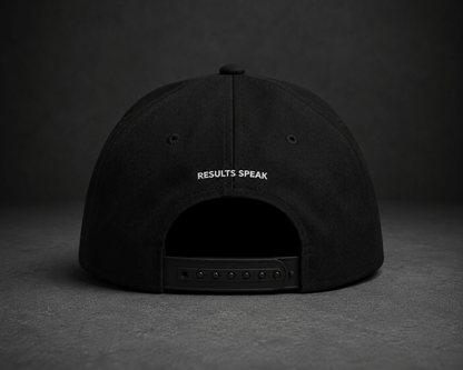 Side view of TheCapTribe Quietly Building black premium snapback with minimalist signature embroidery