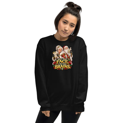 Woman wearing a Black Gildan 18000 crewneck with Mrs. Claus, Santa and HE&