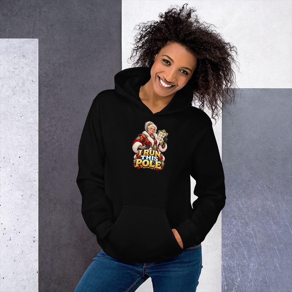 Official mockup of a woman wearing the black Gildan 18500 hoodie with Mrs. Claus and I RUN THIS POLE printed on the front.