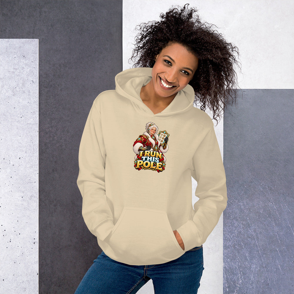 Official mockup of a woman wearing the Sand Gildan 18500 hoodie with Mrs. Claus and I RUN THIS POLE printed on the front.